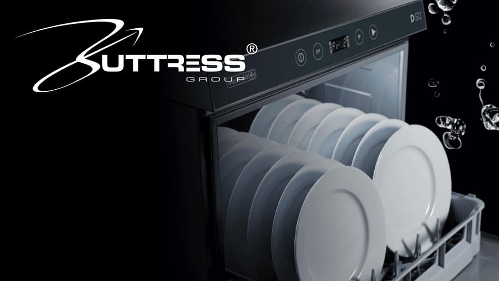 Dishwasher with clean white plates inside at H2 Equity Partners.
