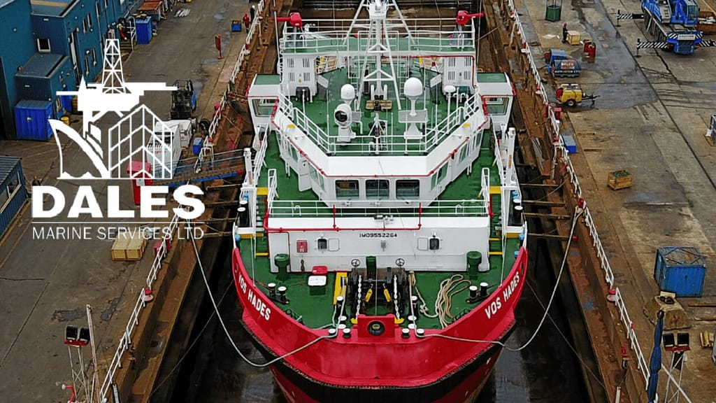 Marine vessel undergoing maintenance in dry dock for inspection and repairs.